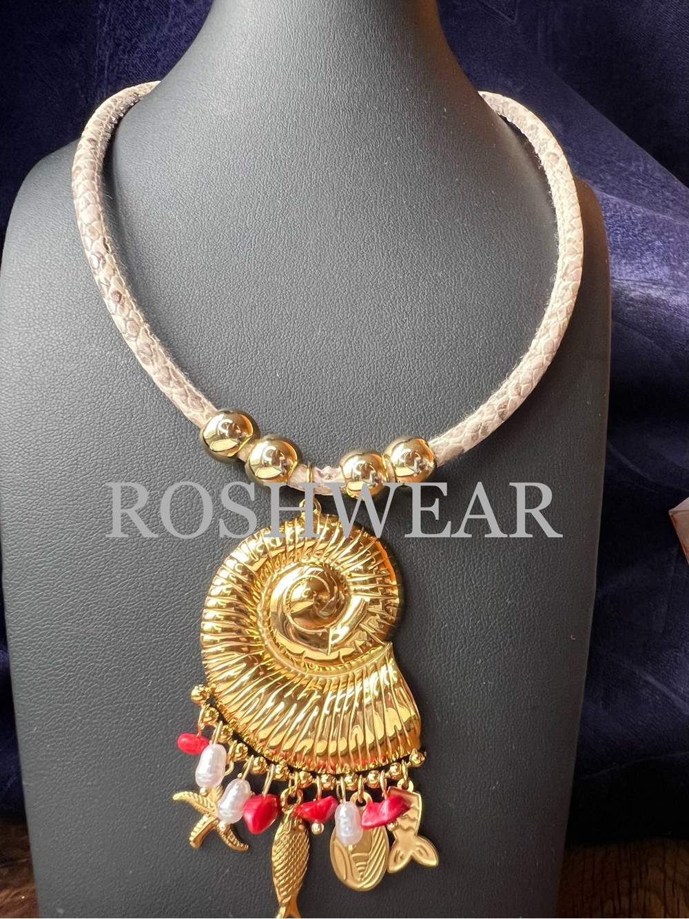 Gold Nautilus Pendant Necklace with Beige Cord and Red Accents